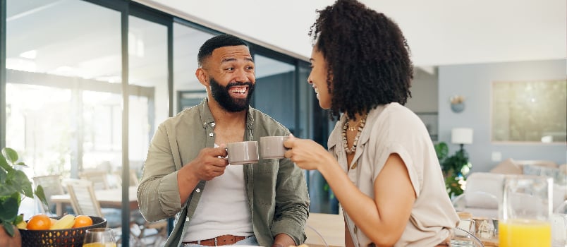 Couple having coffee in the kitchen
