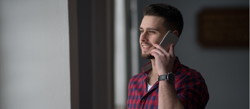 Young man talking on phone