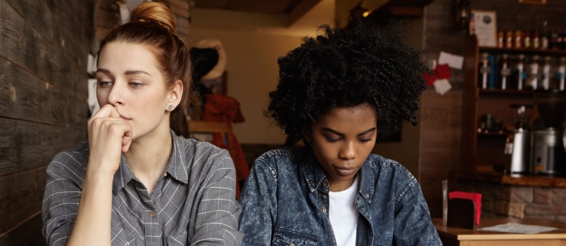 Two woman not talking to each other