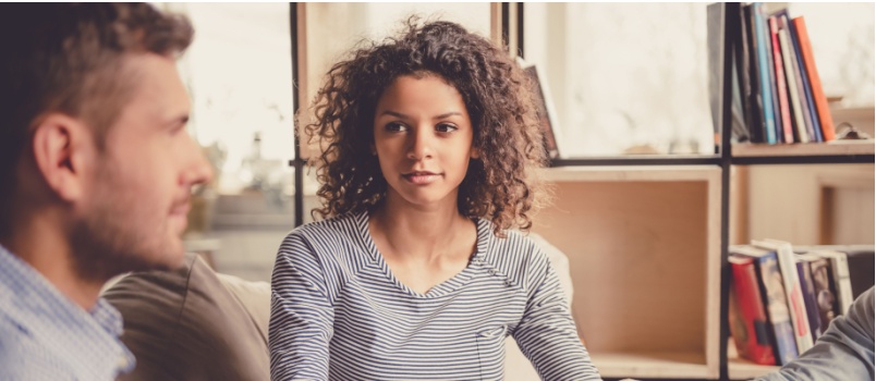 People sitting holding hand