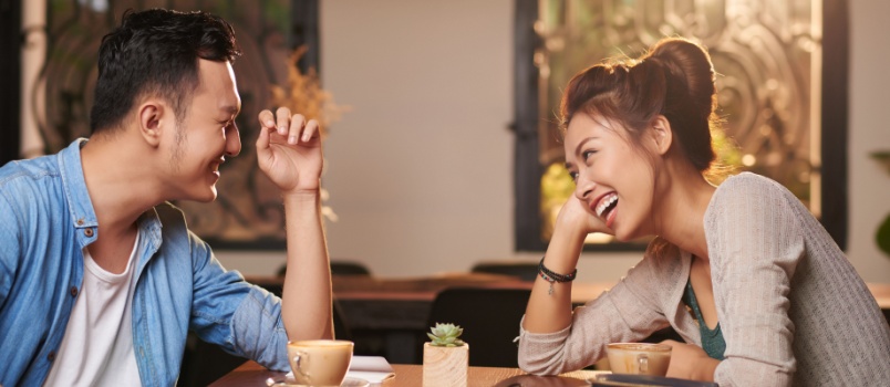 Couple laughing while talking to each other