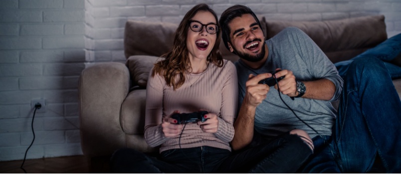 Young couple playing video