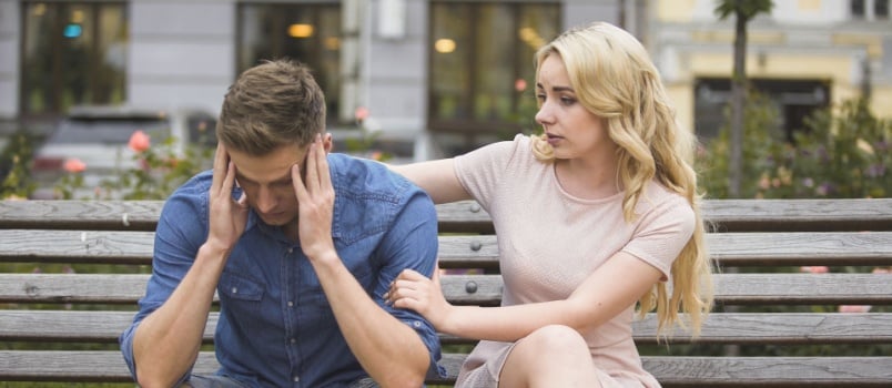 Woman comforting sad man