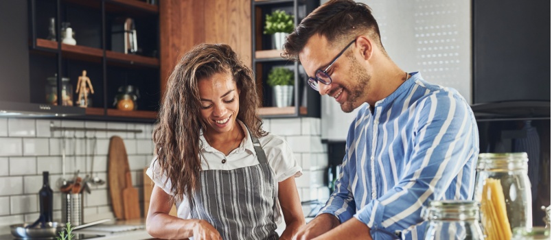 Couple preparing meal together