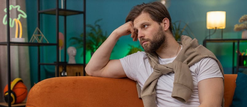 Man sitting on sofa in the house