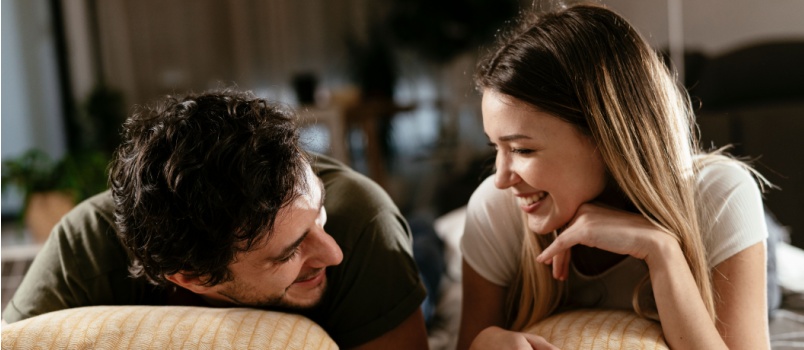 Lovely couple relaxing on the bed