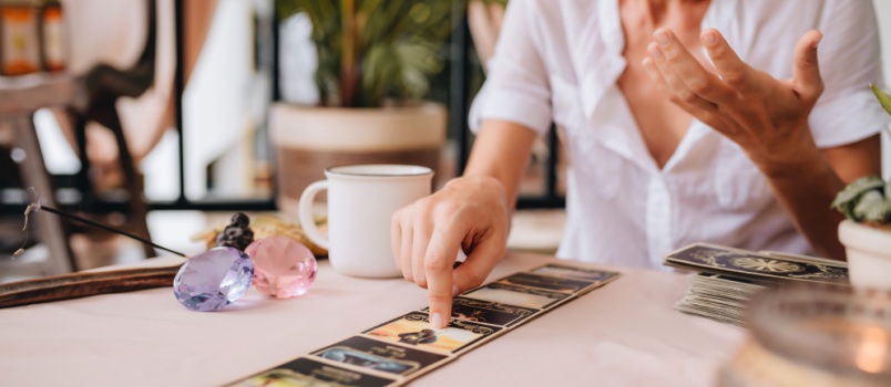 Mid aged professional woman having tarologist session