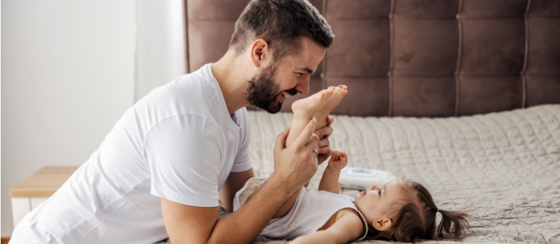 Father playing with her daughter