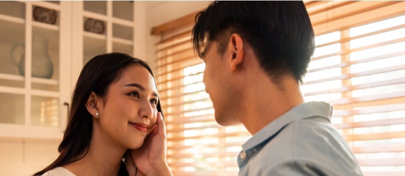 Young man and woman kissing each other