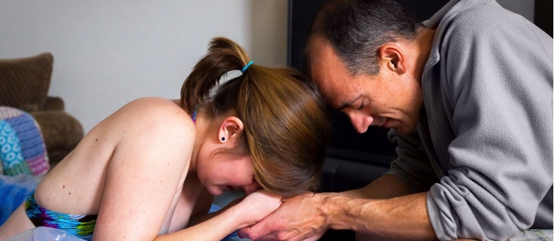 Man extending his support to his wife