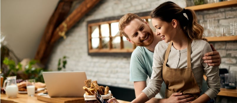 Man helping her wife in the kitchen