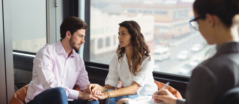 Couple consulting with expert
