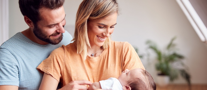 Parents showering their love on their baby