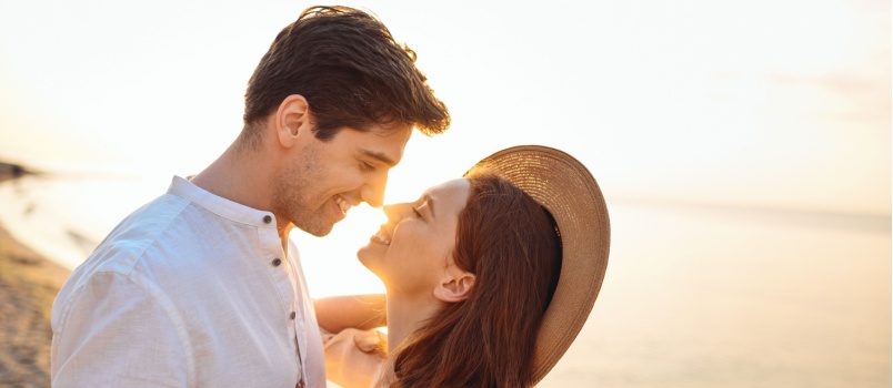 Young happy couple about to kiss
