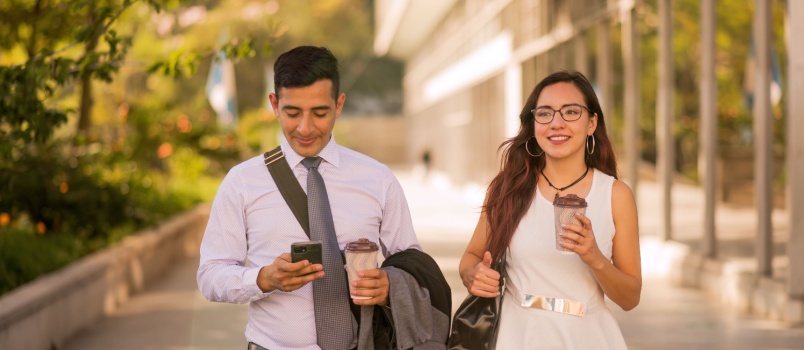 Business couple walking on road