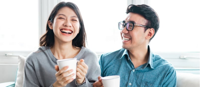 Asian couple having coffee together