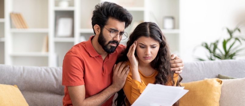 Couple reading bad news
