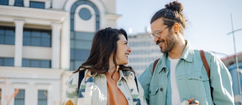 Happy couple doing walking on street