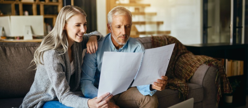 Couple reading insurance documents