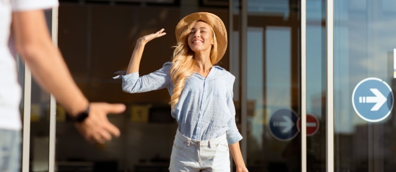 Women waving her hand to her friend