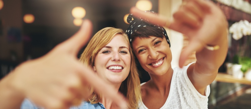 Young woman framing their faces