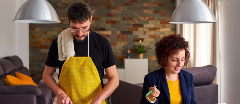 Couple working in kitchen together