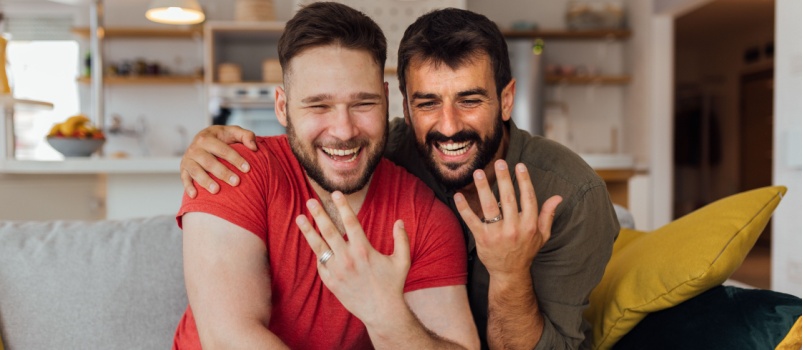 Young happy gay couple