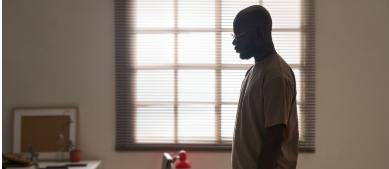 Depressed man standing alone