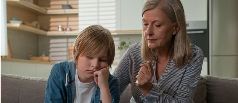 Senior woman having word with kid