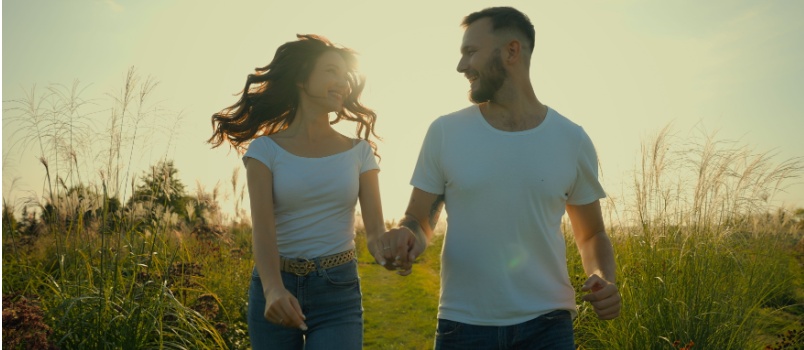 Happy couple laughing walking