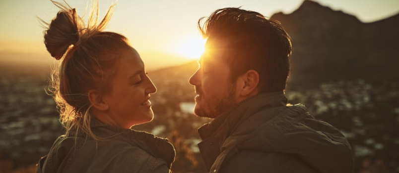 Young couple enjoying sunset