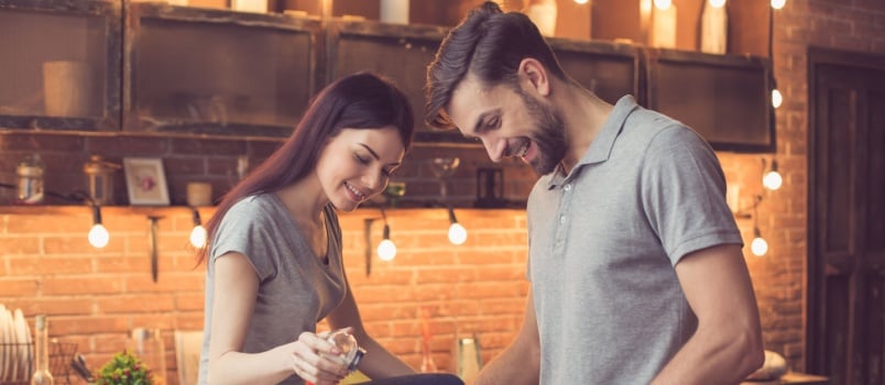 Young couple cooking together in kitchen