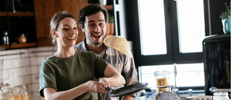 Young couple cooking together