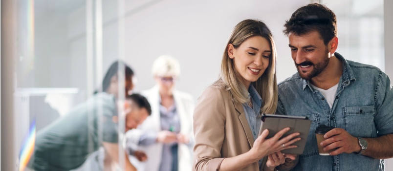 Two business couple using digital laptop