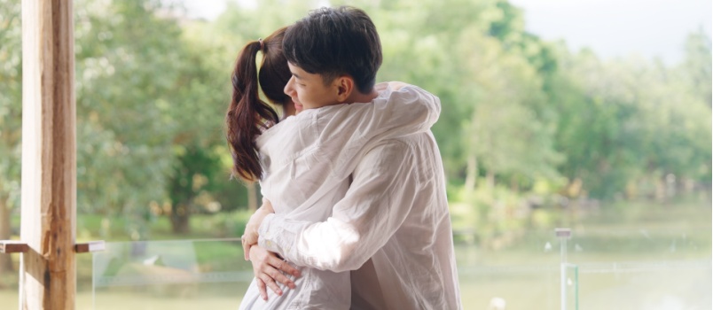 Young happy couple hugging each other