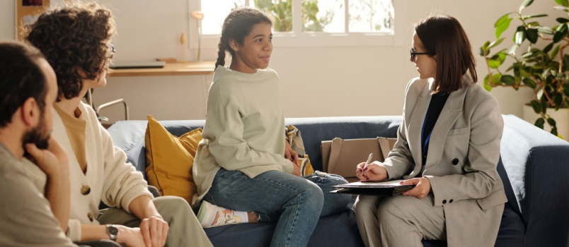 Social worker talking to girl