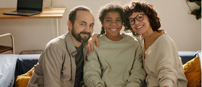 Happy family sitting together