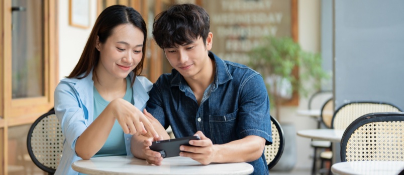 Asian couple watching mobile