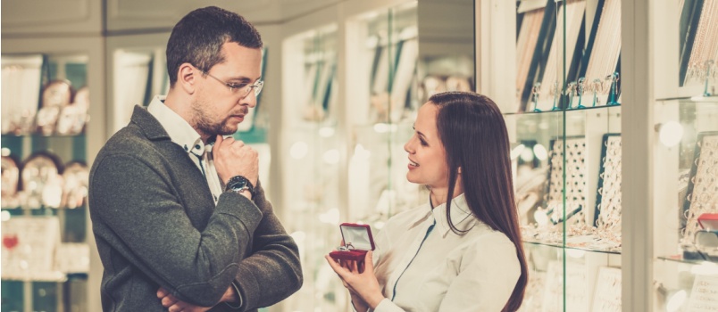 Man assisting helping choosing the ring