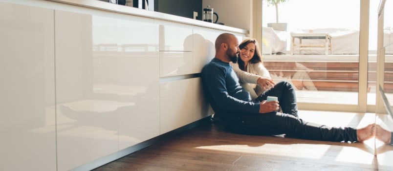 Young couple sitting on floor