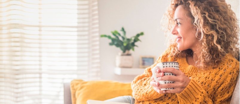 Relaxed woman having coffee