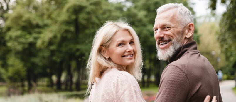 Old aged couple walking in park