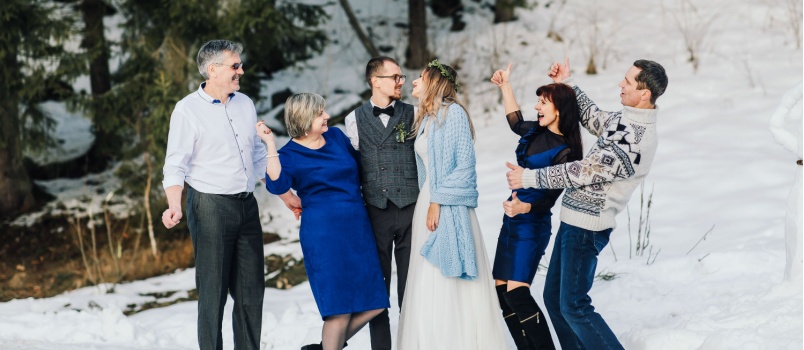 Wedding couple celebrating with family