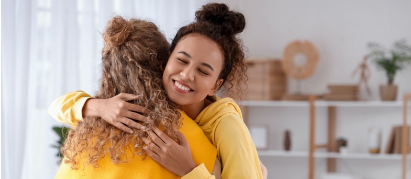Young woman hugging each other