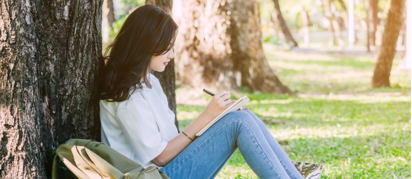 Woman writing notebook