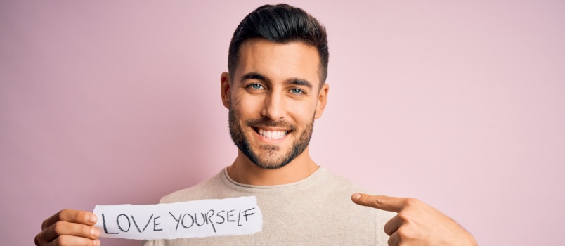 Handsome man holding paper