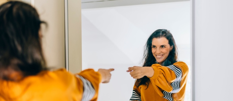 Young woman pointing finger