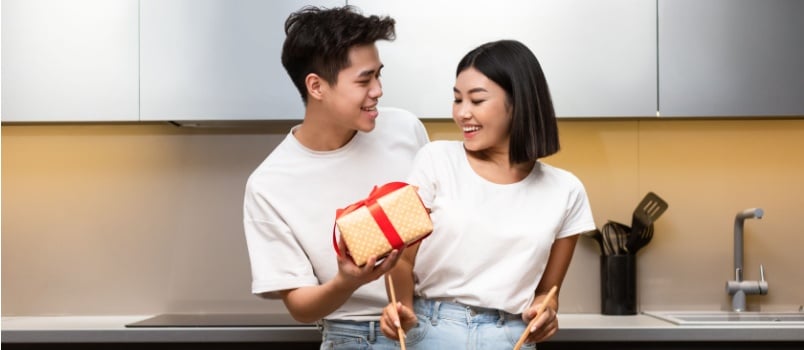 Man giving gifts to woman