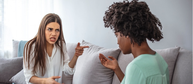 Two woman sitting on couch