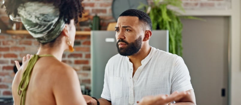 Young couple having argument in kitchen